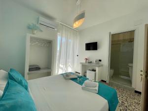 Posteľ alebo postele v izbe v ubytovaní B&B Poesia