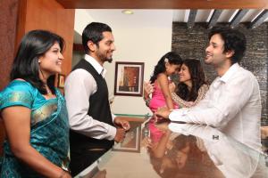 a group of people standing in a room at Century Grand Hotel in Mananthavady