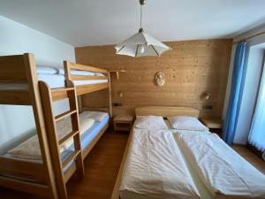 Posteľ alebo postele v izbe v ubytovaní Saskia Residence
