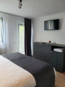 Postel nebo postele na pokoji v ubytování Hanul Doftana