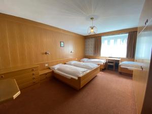 Posteľ alebo postele v izbe v ubytovaní Saskia Residence