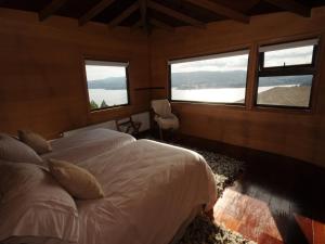 Postel nebo postele na pokoji v ubytování OCIO Territorial Hotel
