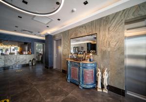 a lobby with a vanity and a mirror at Sea Palm Otel Yalıkavak in Yalıkavak