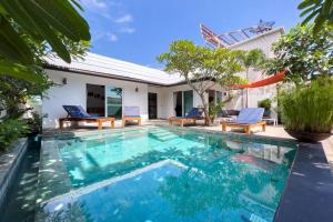 a swimming pool in front of a villa at Pool Villa Bangrak, 2 mins to beach!!!! in Koh Samui 