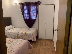 Postel nebo postele na pokoji v ubytování Las Casitas + 16 fotografií