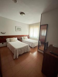 Postel nebo postele na pokoji v ubytování Hotel Valdés