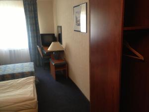 Postel nebo postele na pokoji v ubytování Hotel TenisHouse