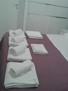 a group of white towels sitting on a table at SEA VIEW in Zadar