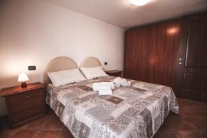 Postel nebo postele na pokoji v ubytování Residence Aquila - Bilo Zerbion