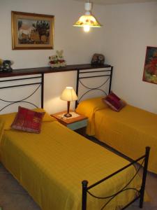 Postel nebo postele na pokoji v ubytování appartamento con giardino