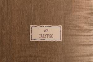 a label on the side of a door with the name ak calysso at Le Dimore di Puglia - Palazzo Ladogana in Monopoli