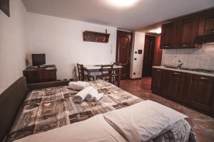Postel nebo postele na pokoji v ubytování Residence Aquila - Mono Punta Valnera