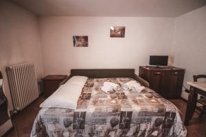 Postel nebo postele na pokoji v ubytování Residence Aquila - Mono Punta Valnera