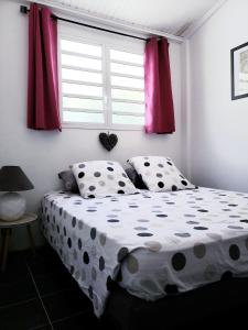 Una cama o camas en una habitación de RESIDENCE COCO