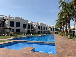Piscina de la sau aproape de Punta Prima Villa 3 bedrooms and solarium sea view