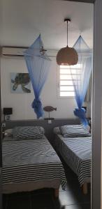 Una cama o camas en una habitación de RESIDENCE COCO