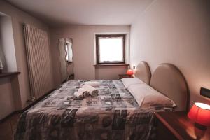Postel nebo postele na pokoji v ubytování Residence Aquila - Bilo Punta Valfredda