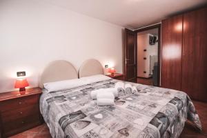 Postel nebo postele na pokoji v ubytování Residence Aquila - Bilo Punta Valfredda