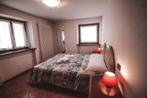 Postel nebo postele na pokoji v ubytování Residence Aquila - Bilo Punta Valfredda