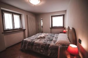 Postel nebo postele na pokoji v ubytování Residence Aquila - Bilo Punta Valfredda