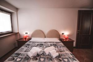 Postel nebo postele na pokoji v ubytování Residence Aquila - Bilo Punta Valfredda