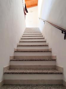 a staircase in a building with concrete steps at La cortese - By Ligooria in Pietra Ligure