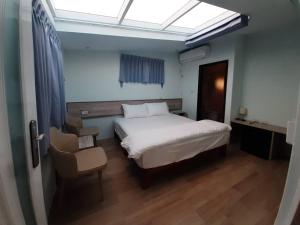 Postel nebo postele na pokoji v ubytování Yueli Homestay