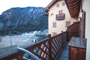 a balcony of a building with a view of a mountain at Residence Aquila - Mono Le Tre Dame in Brusson