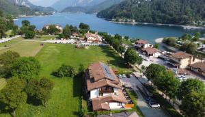 an aerial view of a village with a lake at Hotel Garni Minigolf in Ledro