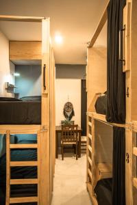 Postel nebo postele na pokoji v ubytování Maui Hostels Playa del Carmen