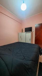 Ein Bett oder Betten in einem Zimmer der Unterkunft Providencia alquiler temporario-turístico