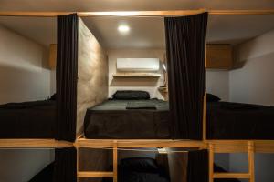 Postel nebo postele na pokoji v ubytování Maui Hostels Playa del Carmen