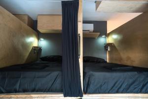 Postel nebo postele na pokoji v ubytování Maui Hostels Playa del Carmen