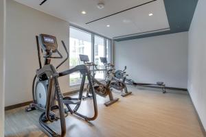 a gym with two exercise bikes in a room at Stylish Condo at Clarendon with Rooftop Views in Arlington