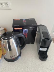 a coffee maker and a printer on a counter at Apartmani Begic 1 i 2 in Barbat na Rabu