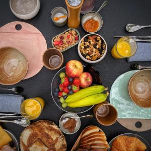 a table topped with lots of different types of food at SENSI - 'FIRE' Restaurant and Glamping in Oostkamp