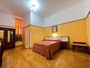 Postel nebo postele na pokoji v ubytování Hotel Isabel