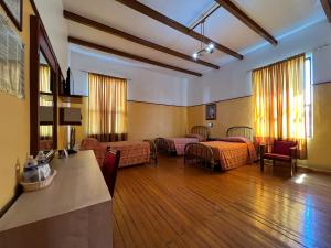 Tempat tidur dalam kamar di Hotel Isabel