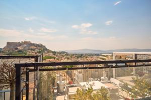 a view of the city from the balcony of a house at Urban Frame Plaka in Athens