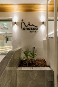 a lobby of anasazi office with a sign on the wall at Anassa Suites in Leptokaria