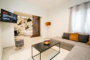 a living room with a couch and a table at *Magnifique* New House - Full Comfort! in Volos