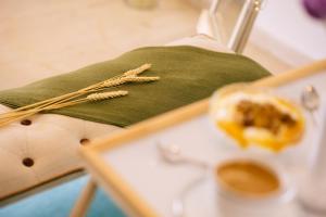 a table with two chopsticks and a plate of food at Breathless Sea Studio in Rethymno Town +20 photos