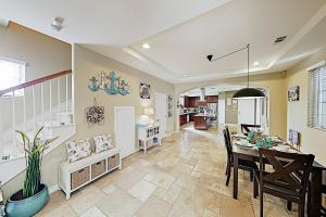 a dining room and kitchen with a table and chairs at Westwood House in Oceanside