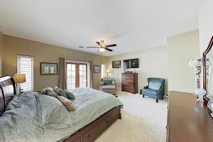 a bedroom with a bed and a desk and a chair at Westwood House in Oceanside