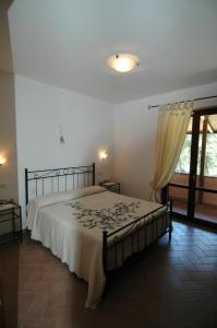 Postel nebo postele na pokoji v ubytování Agriturismo San Vincenzo