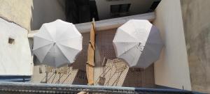 a row of umbrellas sitting on top of a wooden floor at Archeo in Istanbul