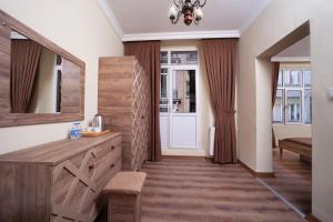 a room with a mirror and a dresser and a door at taxim cool in Istanbul