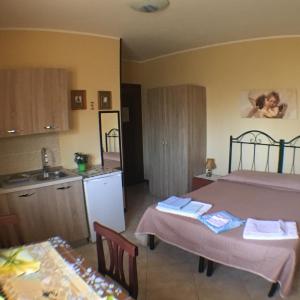 Køkken eller tekøkken på Monolocale e Bilocale Villa Adelaide