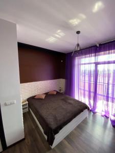 Postel nebo postele na pokoji v ubytování lounge apartment
