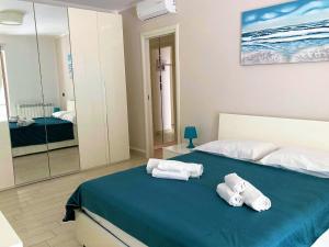 Posteľ alebo postele v izbe v ubytovaní La Casa del Mare